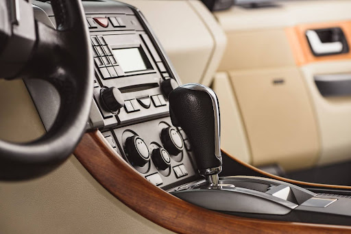 Side view of stylish leather car interior and console.